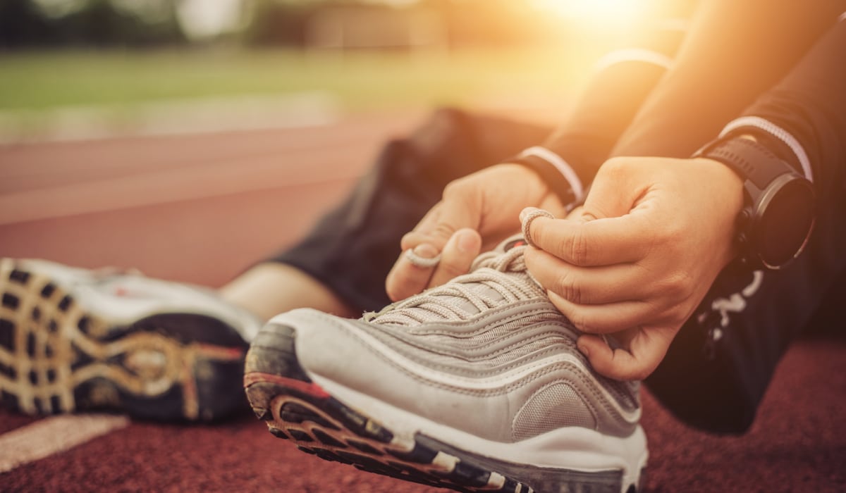 Tying shoes to exercise on track